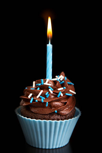 Birthday cupcake on black stock photo