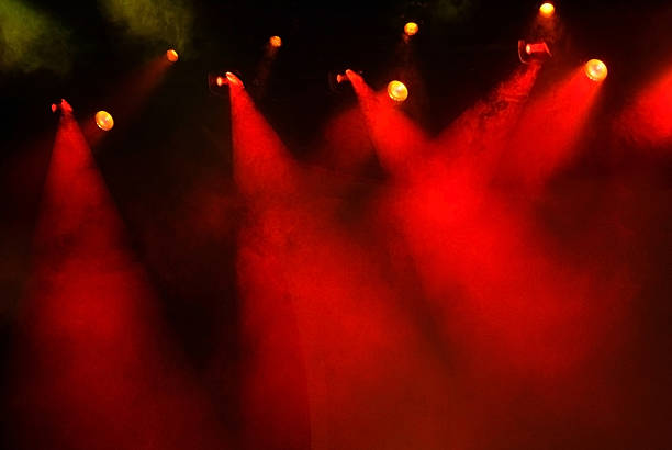 istock Numerous Red Stage Lights with Fog and a Dark Background 172252744