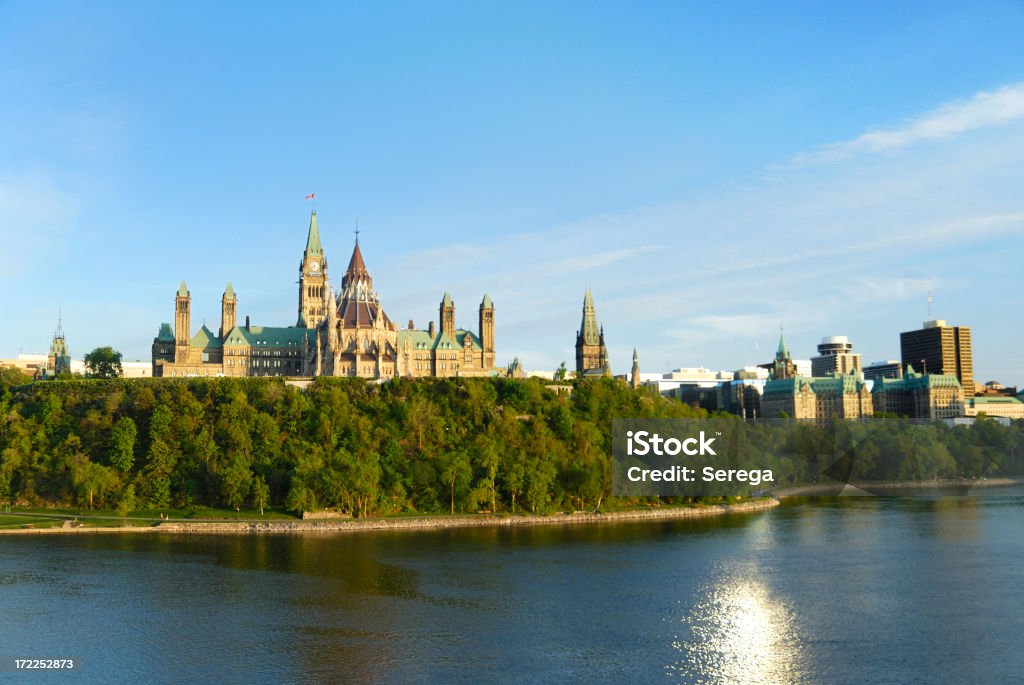 A distant view from the river of Parliament "Parliament Hill in Ottawa, Canada at sunset. View from Ottawa river.More Ottawa photos in Ottawa Lightbox:" Parliament Hill - Ottawa Stock Photo