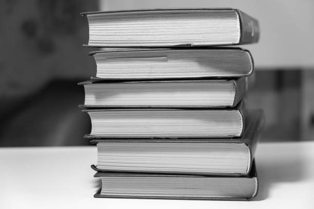 istock Stack of books on a white background. One book is yellow. 1722536704