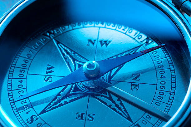 Close up of face of deep blue compass Compass nautical compass stock pictures, royalty-free photos & images