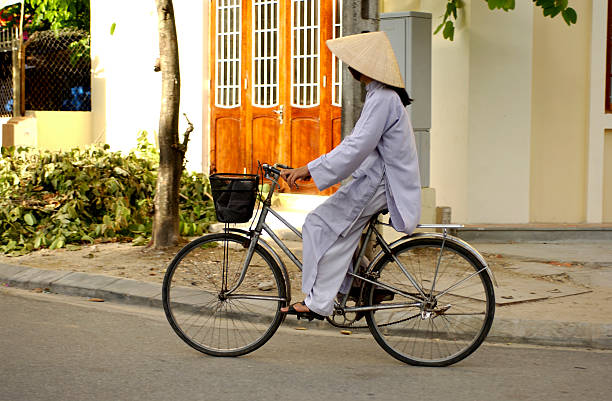 istock Vietnamese Woman on Bicycle 172253763