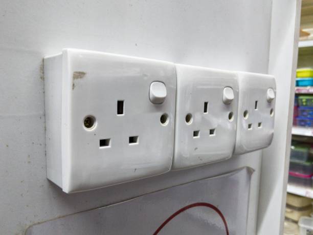istock Three white box switches on the wall. 1722544505