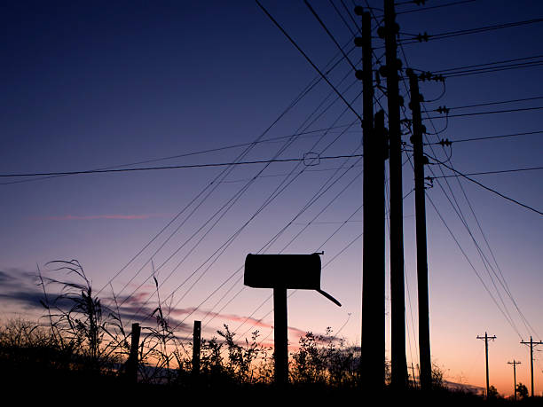 Open Mailbox Against a Blue and Pink Sunset stock photo