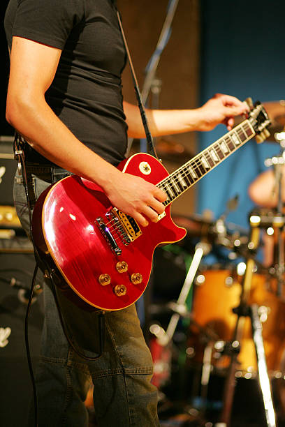 istock Male guitarist tuning his guitar 172256013