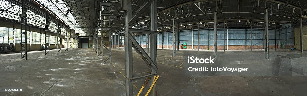 Industrial interior panorama Large interior shot of an empty manufacturing building with skylights and steel superstructure. Adobe RGB 1998 color profile. Abandoned Stock Photo