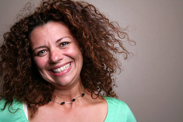 istock curly hair smiling laughing woman 172256132