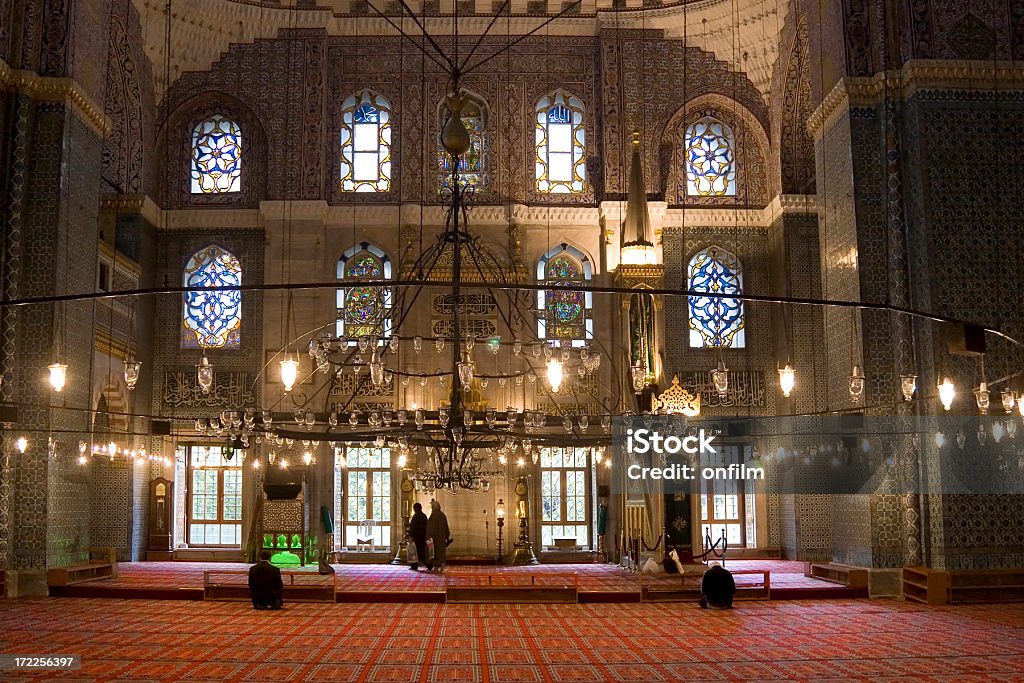 New Mosque, Istanbul "Interior of the 17th century Yeni Mosque, better known in the West as the New Mosque." Arabic Script Stock Photo