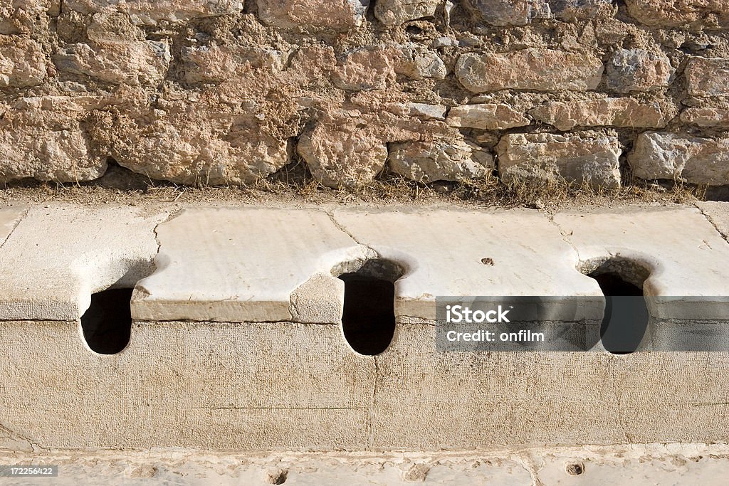 Public toilets, Ephesus, Turkey "The latrina (public toilet), in the ancient city of Ephesus." Roman Stock Photo