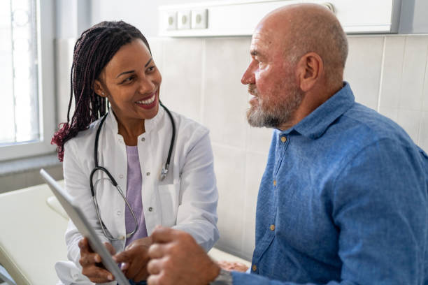 istock Female doctor and patient going over test results using digital tablet at doctor's office 1722567649