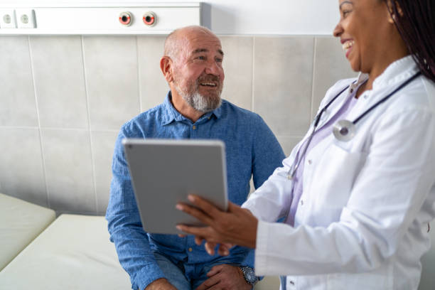 istock Female doctor and patient going over test results using digital tablet at doctor's office 1722567749