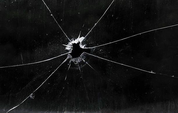 A bullet hole in a glass window