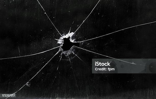 A Bullet Hole In A Glass Window Stock Photo - Download Image Now - Shattered Glass, Glass - Material, Bullet