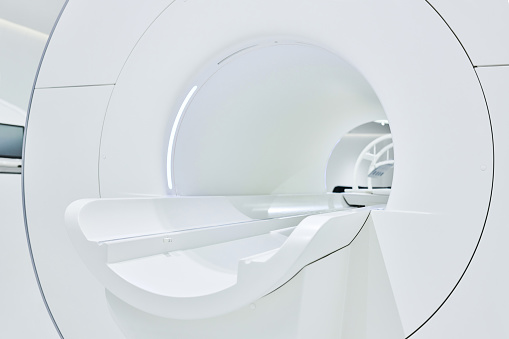 Side view & close-up of modern magnetic resonance imaging.