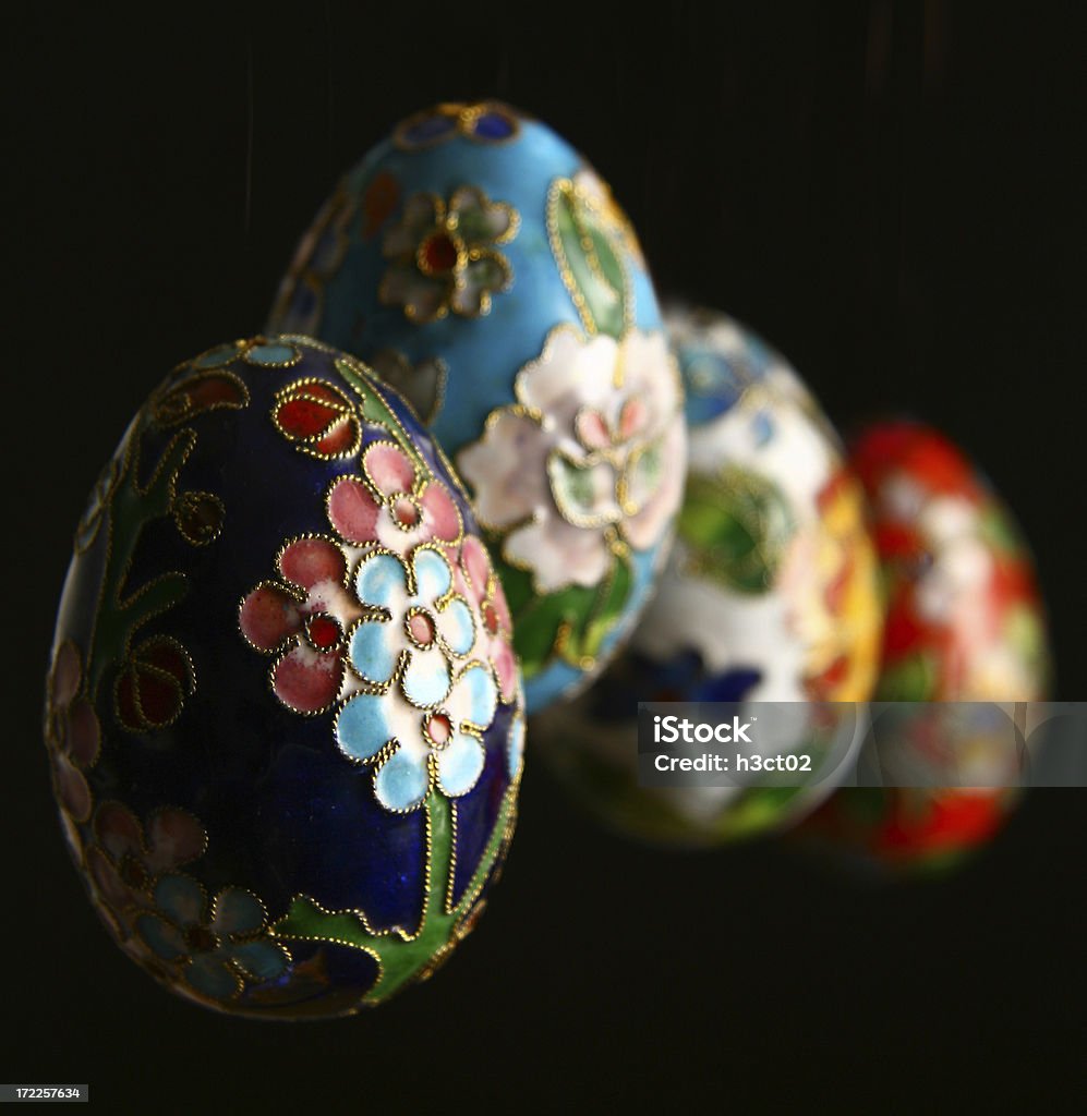 Cloissone Eggs "Four chinese cloisonne eggs isolated on black - commonly found in chinese tourist shops - shallow DOF, focus is on the first egg." Easter Stock Photo