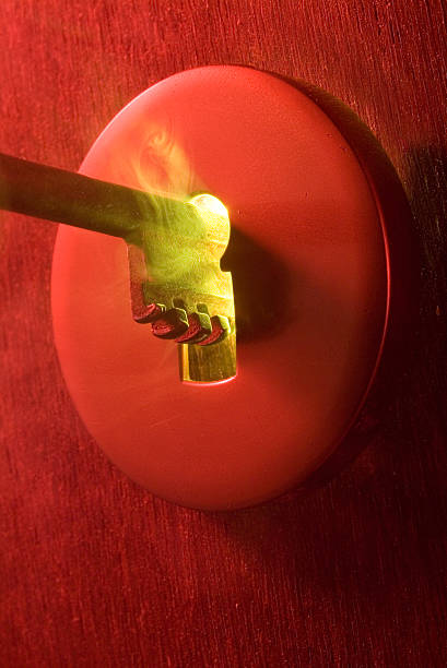 istock golden key in glowing and steaming red lock 172257697