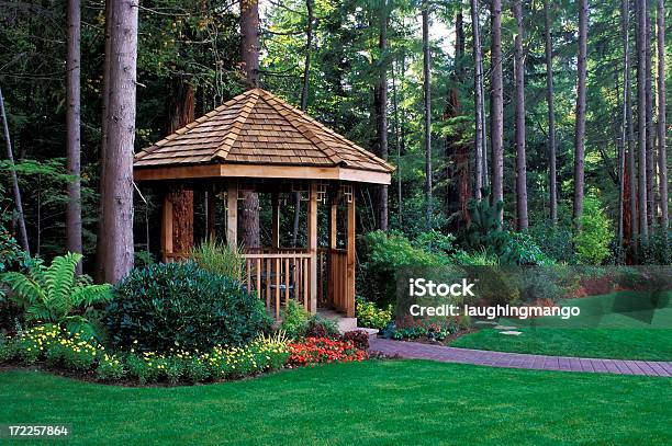 A Beautiful Backyard Garden With A Cedar Wood Gazebo Stock Photo - Download Image Now