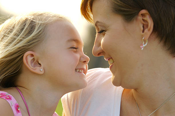 istock Mother and daughter happily facing each other 172257885