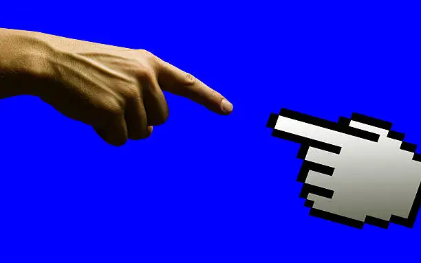 Pointing male hand and cursor hand about to touch and create something amazing! Similar to Michelangelo's Sistine Chapel creation scene. Blue background.
