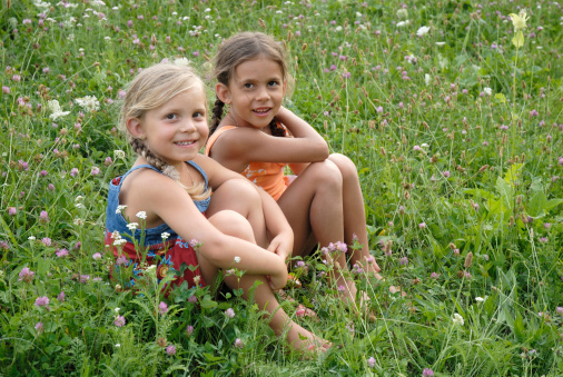 sisters in a blooming meadow