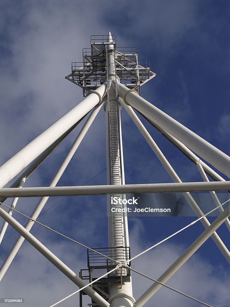 Sports stadium floodlight superstructure Floodlight and superstructure at an English soccer stadium. Architectural Column Stock Photo