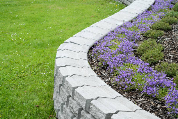 istock White granite garden ornament with flowers inside 172259884