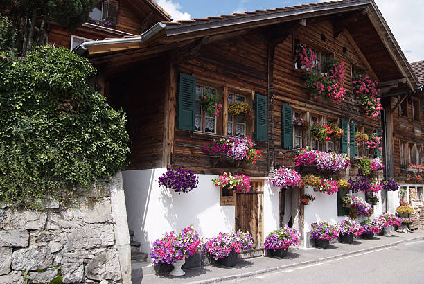 Old Chalet decoreated with flowers at Brienzersee in Central part of Switzerland