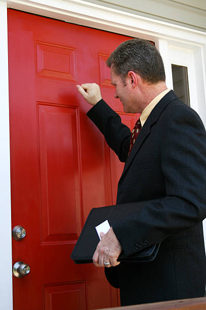 Salesman Salesman at the door knocking on door stock pictures, royalty-free photos & images