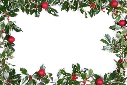 Variegated holly frame with Christmas baubles.