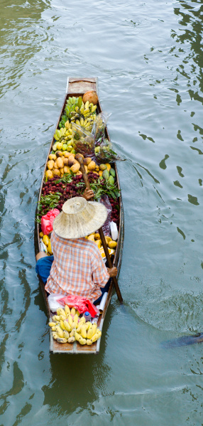 Farmer selling tropical fruit at one of Thailand's floating marketsA lightbox full of Southeast Asia Images: