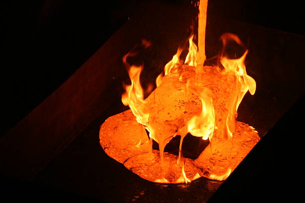 gold pour - melting furnace стоковые фото и изображения