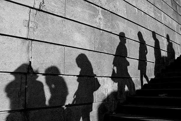 Anonymous Shadows on the wall unrecognizable person stock pictures, royalty-free photos & images