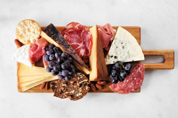 istock Charcuterie board top view on a white marble background 1722627803