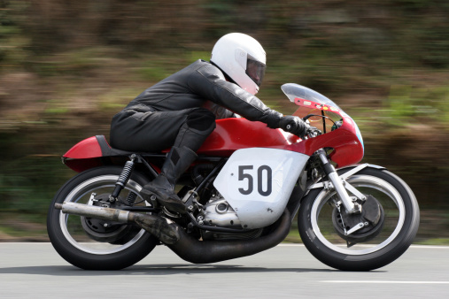 A classic Rider at speed in at the Manx Grand Prix Road Race.Similar images :
