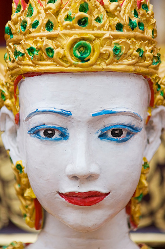 Detail of traditional wooden sculpture used at a festival in the North of Thailand. This is one of many the same on a parade car.