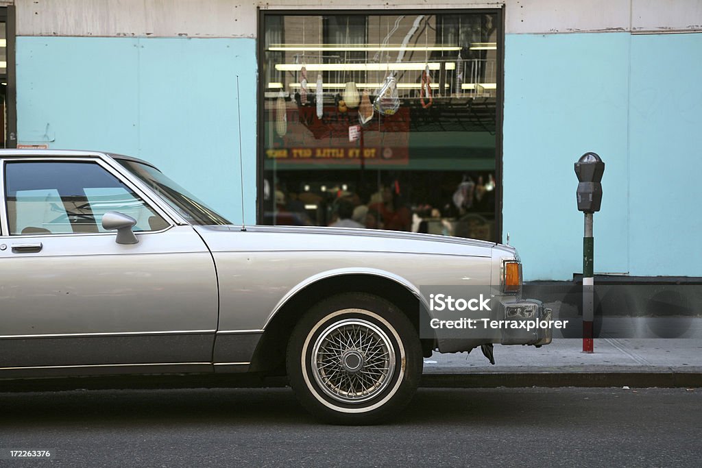 Mulberry Street, Little Italy, New York An old sedan car parked outside an Italian delicatessen in Little Italy, New York City, New York, USA. Car Stock Photo