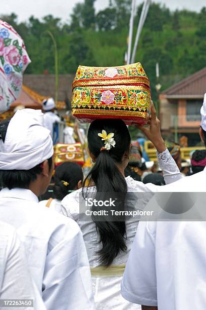 Balinese Woman Carrying Offerings On Her Head Stock Photo - Download Image Now - 20-29 Years, Adult, Adults Only