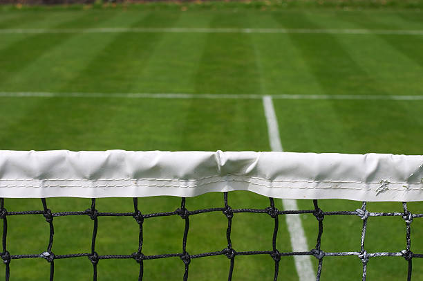 This is the view an attacking player gets when he is 'at the net' in grass-court tennis. It's a view many modern singles players hardly ever see during play on other, slower, surfaces. Southfields, near Wimbledon, London.