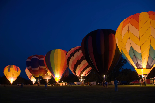 Image of hot air balloons launching and taking flight captured during the Canberra Enlighten Festival, in Australia 2024.
