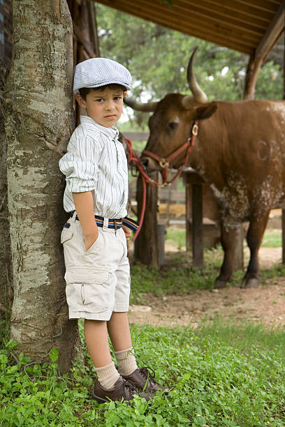 istock Boy Standing near Longhorn 172264603