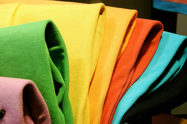 polo-shirts - polo shirt multi colored clothing variation stock-fotos und bilder