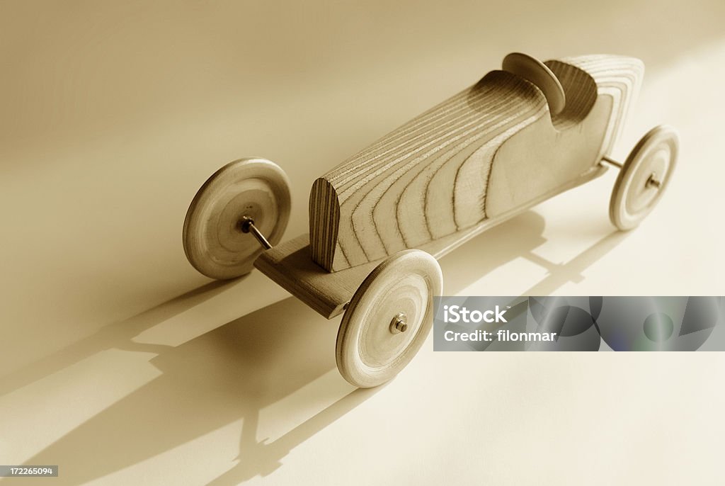 Wooden model Vintage racing car toy in sepia tones Art And Craft Stock Photo