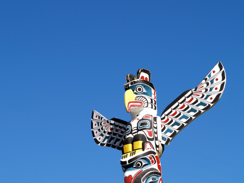 Vancouver, Canada - September 11, 2022: Totem pole in Staley Park is one of many First Nations totem pole on display at the park.