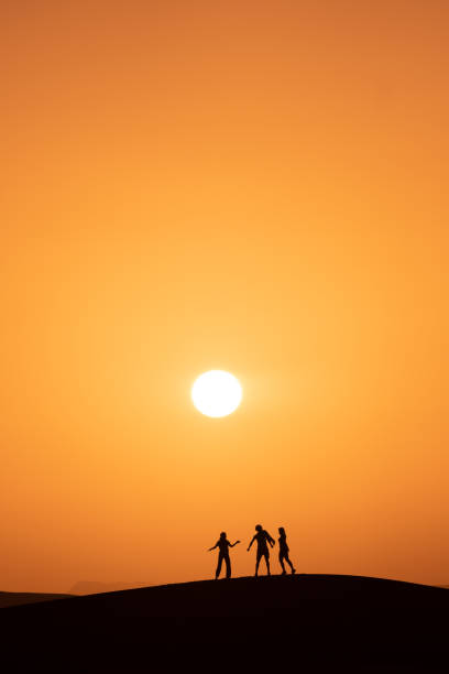 They run and play with the sand, in the Agafay desert