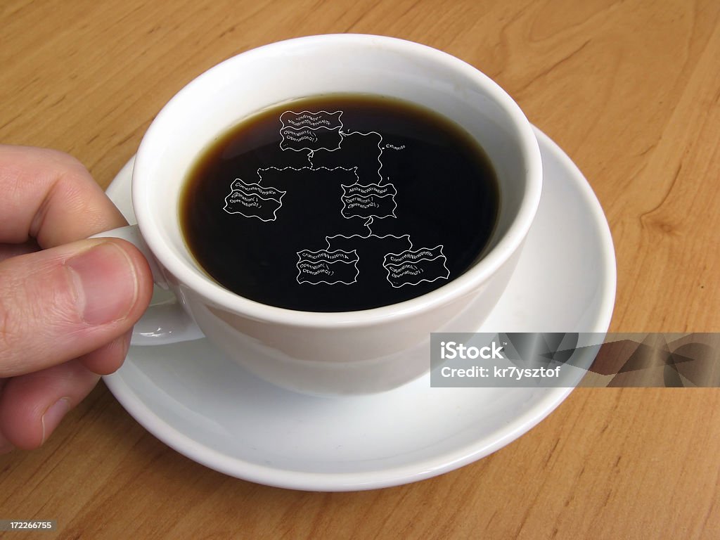 UML coffee A cup of coffee with an uml diagram inside. Black Color Stock Photo