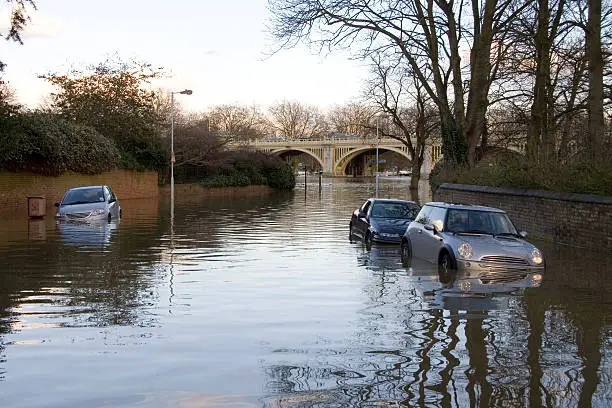 A Spring high tide floods a Richmond street leaving cars waterlogged.