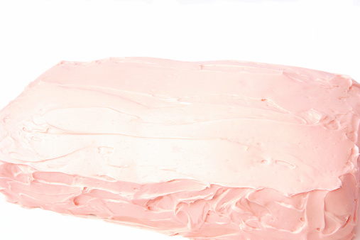 Pink sheet cake from the side/top view