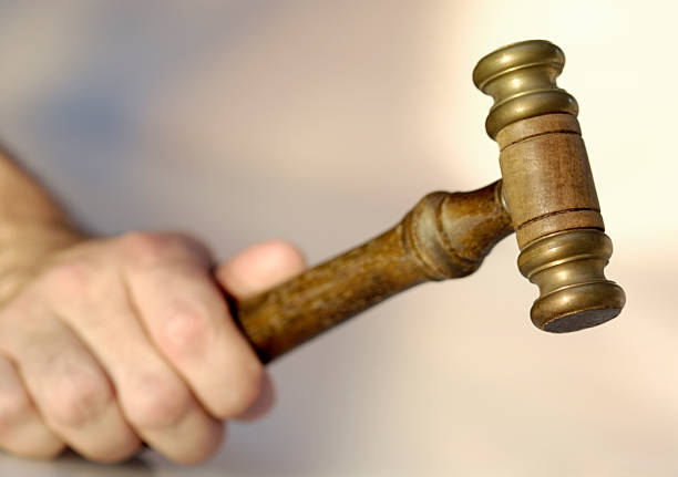 istock Male hand is holding a gavel 172267539