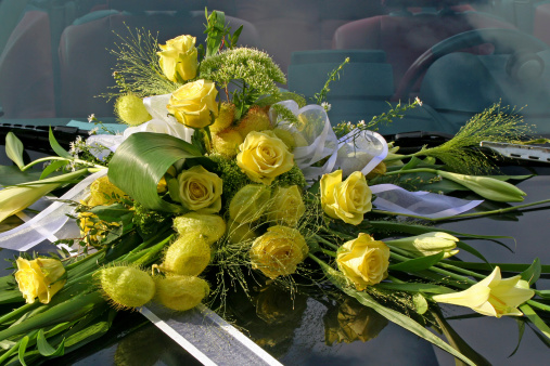 Wedding car. Wedding decoration on wedding car. Luxury wedding car decorated with flowers - selective focus, copy space