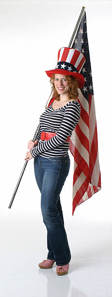 istock Patriotic woman holds large US flag 172267797